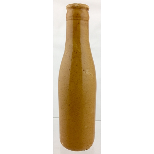 174 - CARLOW GINGER BEER BOTTLE. 6.75ins tall. All
tan, ch, c.c, black transfer for CORCORAN & CO/ CARLOW.... 