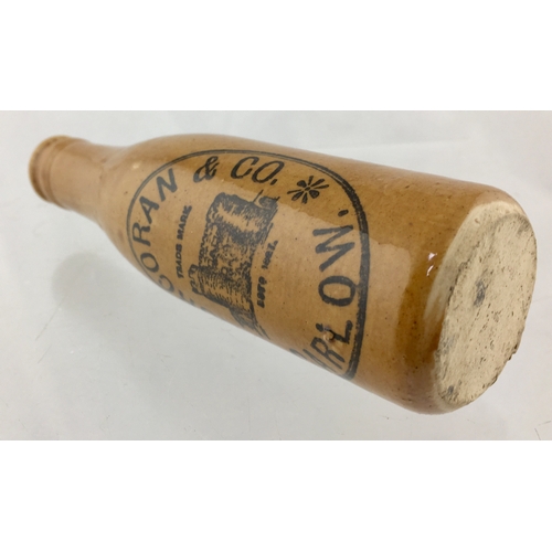 174 - CARLOW GINGER BEER BOTTLE. 6.75ins tall. All
tan, ch, c.c, black transfer for CORCORAN & CO/ CARLOW.... 