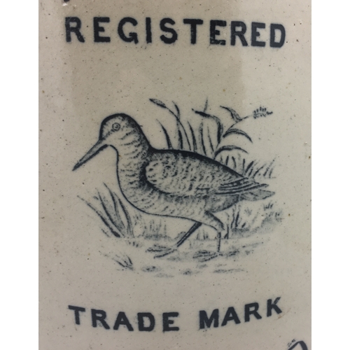 177 - GRIFFIN, WOODCOCK & CO FLAGON. 16.5ins tall. Tan top, lower off white glaze, black transfer GRIFFIN,... 