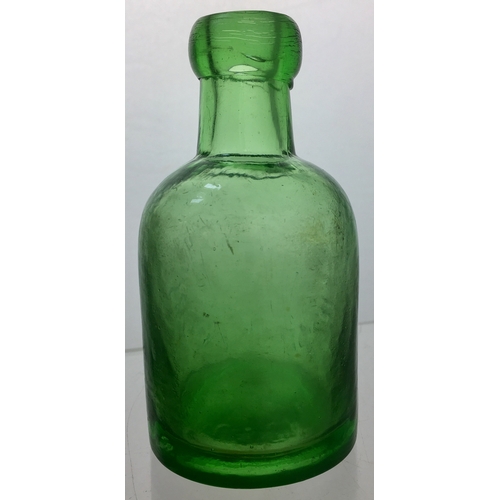 184 - STAINES SELTZER BOTTLE.
4.75ins tall. Light green glass, squat
shape, blob lip, embossed CHARLES
ASH... 