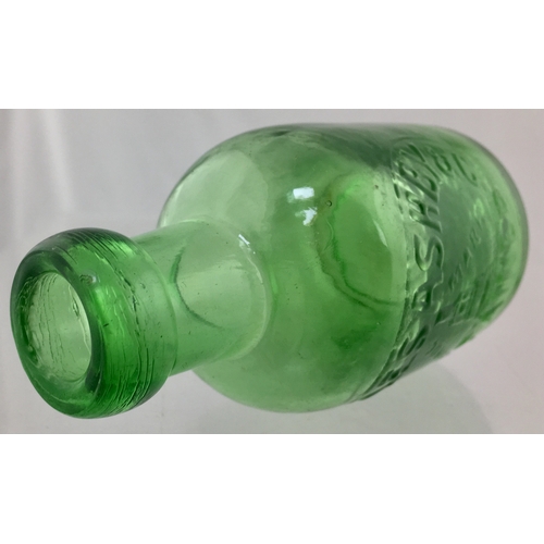 184 - STAINES SELTZER BOTTLE.
4.75ins tall. Light green glass, squat
shape, blob lip, embossed CHARLES
ASH... 