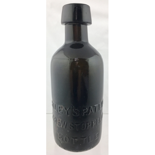 187 - RILEYS PATENT
BOTTLE. 7ins tall.
Very dark amber,
almost black glass
ginger beer, heavily
embossed W... 