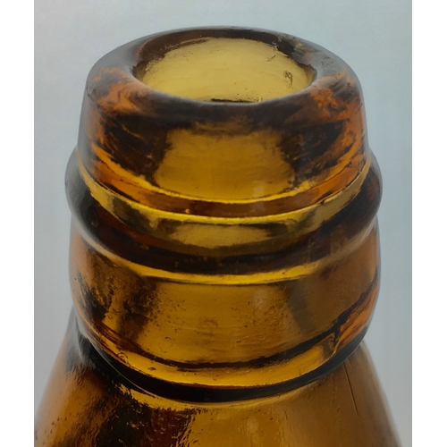 189 - HULME GROVES
& WHITNALL CODD
BOTTLE. 9ins tall.
Burnt orange/ amber
glass, heavily embossed
GROVES &... 