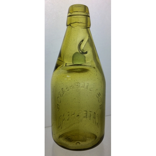 191 - GATESHEAD
DUMPY CODD
BOTTLE. 7.5ins tall.
Light amber glass,
2 neck retaining
lugs, heavily
embossed... 