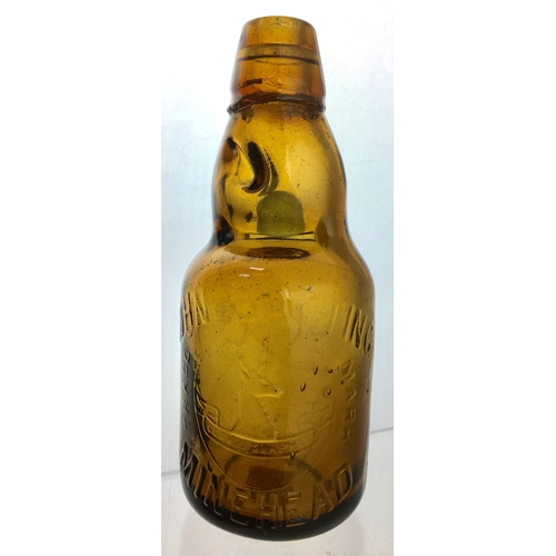 192 - MINEHEAD
DUMPY CODD
BOTTLE. 7.5ins tall.
Dark amber glass,
2 neck retaining
lugs, embossed
JOHN BATT... 