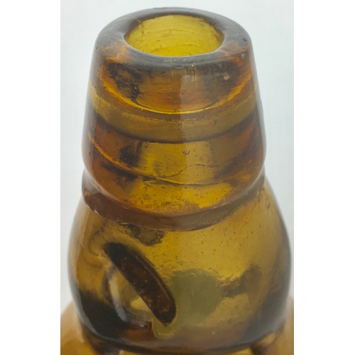 192 - MINEHEAD
DUMPY CODD
BOTTLE. 7.5ins tall.
Dark amber glass,
2 neck retaining
lugs, embossed
JOHN BATT... 