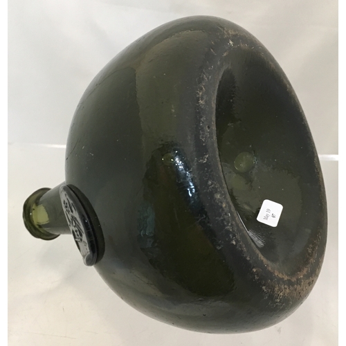 112 - DATED ONION WINE BOTTLE. 6.75ins
tall. Very dark green glass, tapering neck with
thin, pointed edge ... 