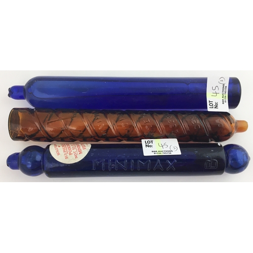 45 - MINIMAX FIRE GRENADE GROUP. Tallest 8ins, two embossed, cylinder shape, cobalt blue plus brown. (3)