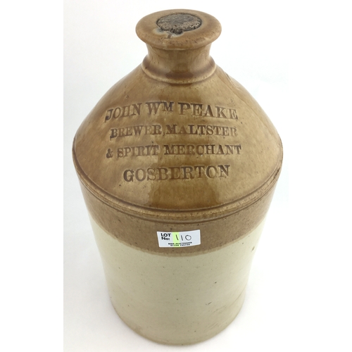 110 - GOSBERTON FLAGON. 13ins tall, t.t., embossed JOHN WM PEAKE/ BREWER, MALTSTER/ & SPIRIT MERCHANT, 1 g... 