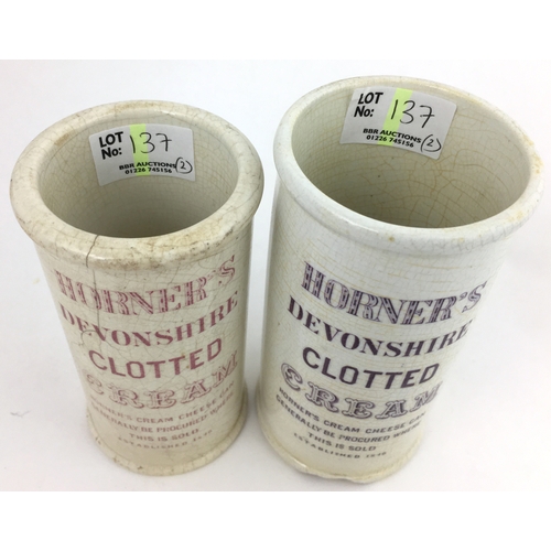 137 - HORNERS DEVONSHIRE CLOTTED CREAM CYLINDER DUO. Tallest 5ins, one pink transfer, one purple, damages.... 