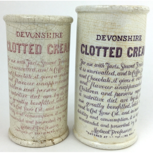 137 - HORNERS DEVONSHIRE CLOTTED CREAM CYLINDER DUO. Tallest 5ins, one pink transfer, one purple, damages.... 