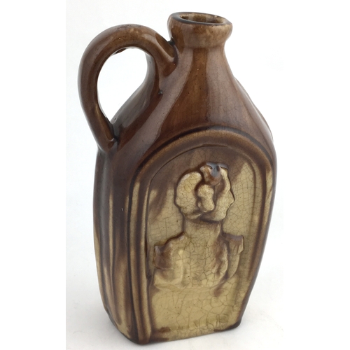 338 - SALT GLAZE FLASK. 7ins tall, silhouette of man & woman to both sides, handled.