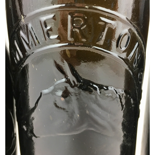 371 - BLACK GLASS PICTORIAL BEERS. Tallest 10.5ins, with stoppers, centre t.m., LONDON & WYCOMBE. (4)