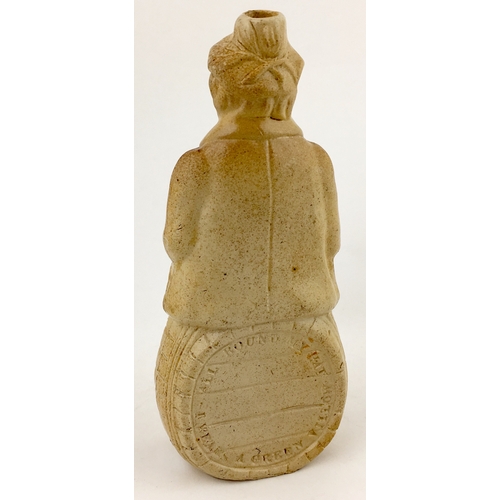 388 - PUB NAMED MAN ON BARREL REFORM FLASK. 8.5ins tall, tan salt glaze. Man shaped flask shaped sat on to... 