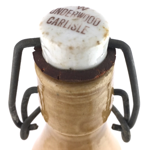 522 - CARLISLE GINGER BEER BOTTLE. 9ins tall to top of original swing stopper. T.t, ch, black transfer W. ... 