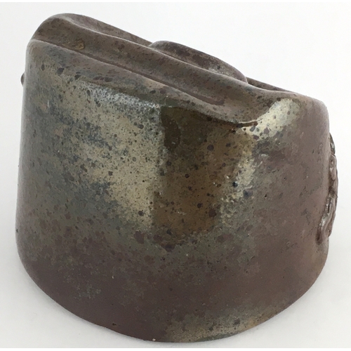 545 - SALT GLAZE INKWELL. 2ins at tallest part. Dark brown glaze, moulded floral sprigging below central f... 