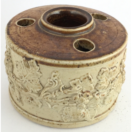 546 - SALT GLAZE INKWELL. 2.1ins diam. Light tan lower, top darker brown glaze, 3 quill holes & central fi... 