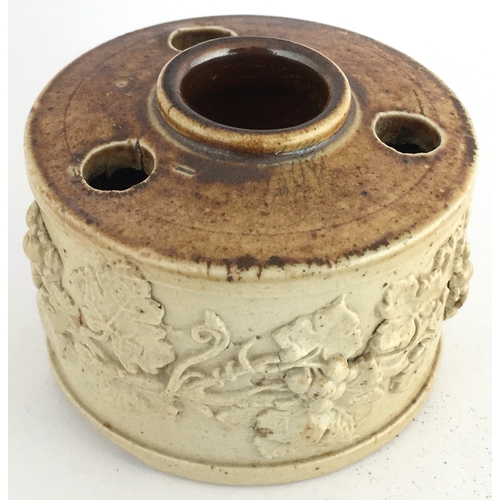 546 - SALT GLAZE INKWELL. 2.1ins diam. Light tan lower, top darker brown glaze, 3 quill holes & central fi... 