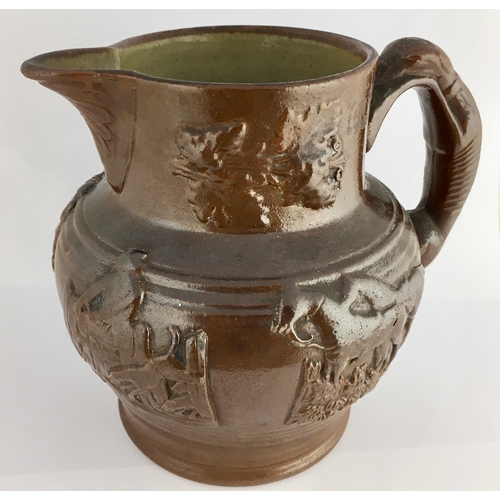 567 - BRAMPTON JUG. 6.5ins tall. All over dark brown glaze, rear greyhound handle. Raised sprig detail ‘Th... 