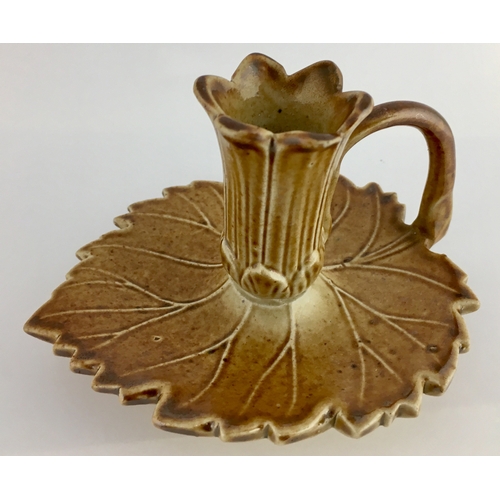 568 - BRAMPTON CANDLE STICK HOLDER. 3ins tall. Light tan salt glaze, base shaped as leaf with central flow... 