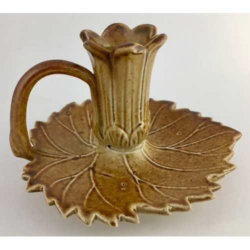 568 - BRAMPTON CANDLE STICK HOLDER. 3ins tall. Light tan salt glaze, base shaped as leaf with central flow... 