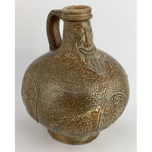 575 - BELLARMINE JUG. Squat, extra bulbous bodied handled jug, variety of tiger effect brown salt glaze. F... 