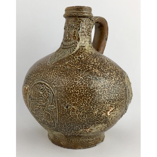 575 - BELLARMINE JUG. Squat, extra bulbous bodied handled jug, variety of tiger effect brown salt glaze. F... 