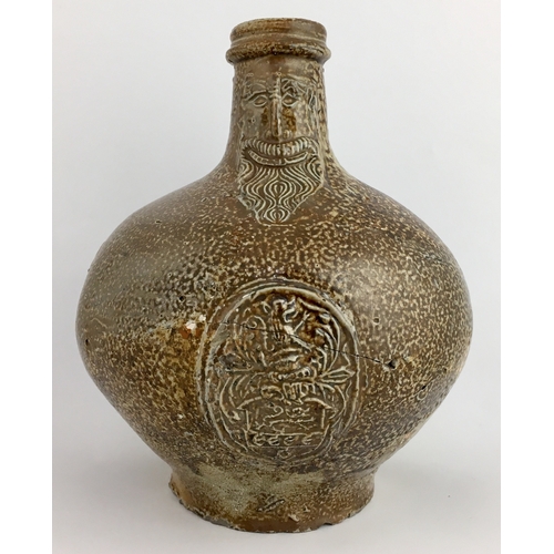 575 - BELLARMINE JUG. Squat, extra bulbous bodied handled jug, variety of tiger effect brown salt glaze. F... 