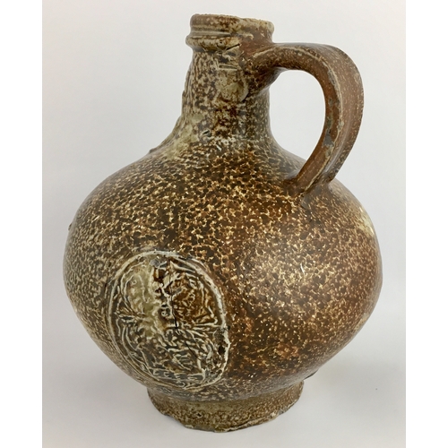 575 - BELLARMINE JUG. Squat, extra bulbous bodied handled jug, variety of tiger effect brown salt glaze. F... 