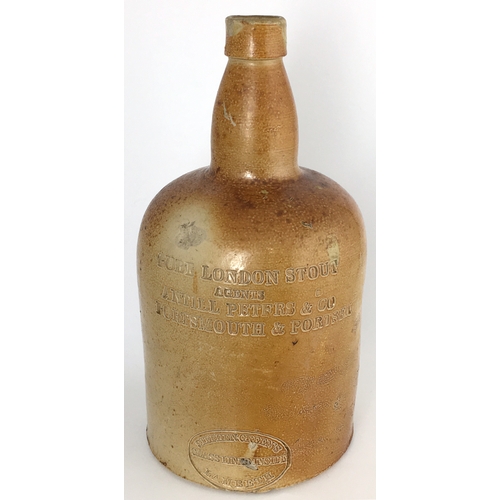 577 - PORTSMOUTH & PORTSEA SALT GLAZE STOUT BOTTLE. 8ins tall. Variating light tan salt glaze, cylindrical... 