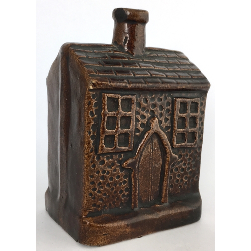 581 - EARLY ROCKINGHAM GLAZE MONEY BOX. 3.5ins tall. Small shiny brown glazed money box formed as house wi... 