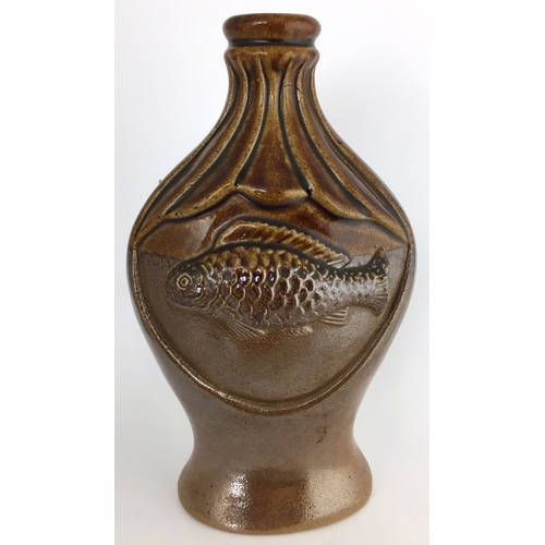 582 - MOULDED FISH SPRIGGED FLASK. 8.25ins tall. Very shiny brown top section, lower dark brown salt glaze... 