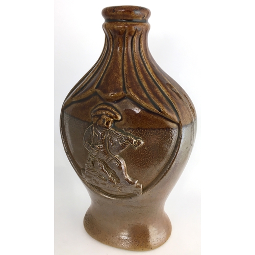 582 - MOULDED FISH SPRIGGED FLASK. 8.25ins tall. Very shiny brown top section, lower dark brown salt glaze... 