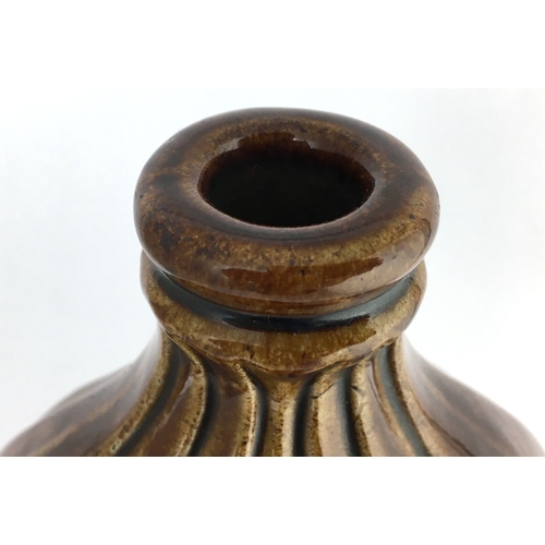 582 - MOULDED FISH SPRIGGED FLASK. 8.25ins tall. Very shiny brown top section, lower dark brown salt glaze... 