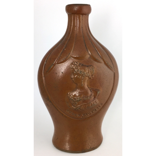 585 - MOULDED FLASK. 7.25ins tall. All over mid brown salt glaze. Flat, ribbed shoulders, shapely flask, t... 