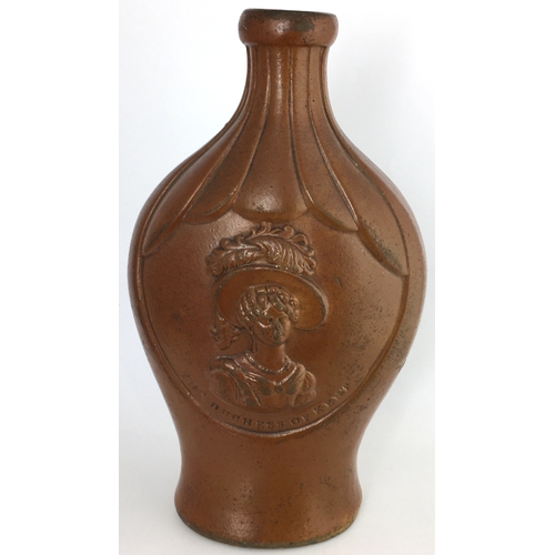 585 - MOULDED FLASK. 7.25ins tall. All over mid brown salt glaze. Flat, ribbed shoulders, shapely flask, t... 