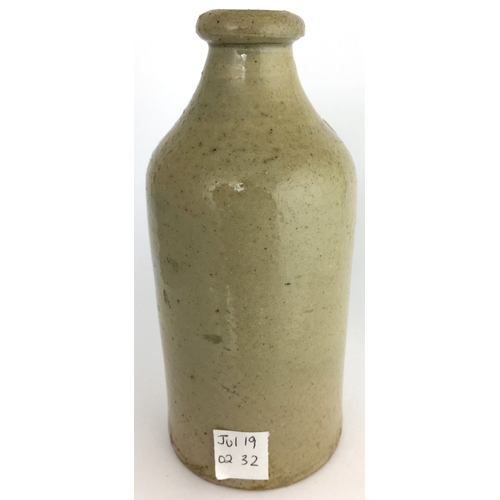 589 - LINCOLN SLAB SEAL VET’Y BOTTLE. 5.5ins tall. Grey/ green slip glaze. Small cylinder shape, short cur... 