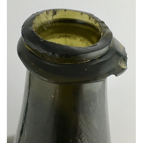 598 - ENGLISH MALLET BOTTLE. 7.25ins tall. Dark green glass, c. 1720-1730, very thin edged string lip (one... 