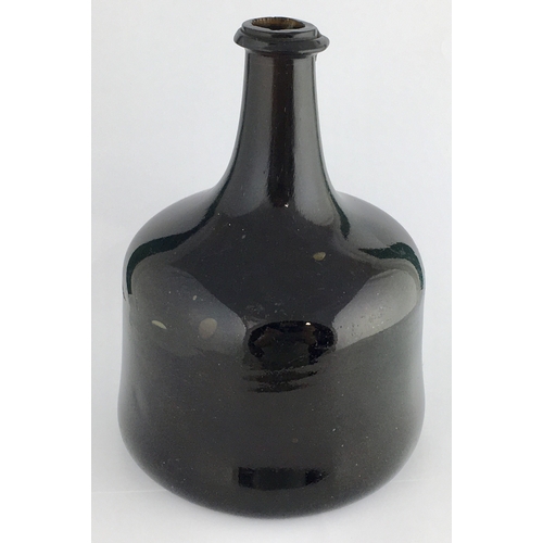 599 - ENGLISH MALLET BOTTLE. 7.2ins tall. Dense black glass, quite chunky v-shaped string rim, reannealed ... 