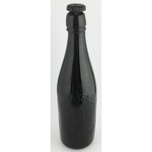 608 - PATENTED GLASS STOPPERED NEWCASTLE BEER BOTTLE. 10.9ins tall, heavy black glass. Elegant champagne s... 