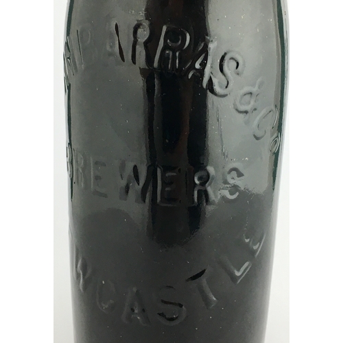 608 - PATENTED GLASS STOPPERED NEWCASTLE BEER BOTTLE. 10.9ins tall, heavy black glass. Elegant champagne s... 