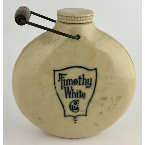 620 - TIMOTHY WHITE ADAPTABLE MUFF WARMER. 3.8ins tall to top of stopper, off white body colour. Flattened... 