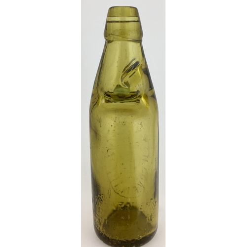 631 - COVENTRY CODD BOTTLE. 9ins tall. Light amber glass, 10oz codd, aqua marble, two neck retaining lugs.... 