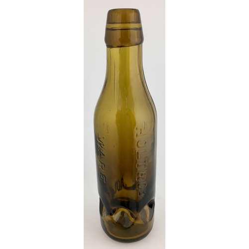 633 - WARE PREMIER PATENT BOTTLE. 9ins tall. Dark amber glass 10oz Premier Patent, 6 retaining lugs near b... 