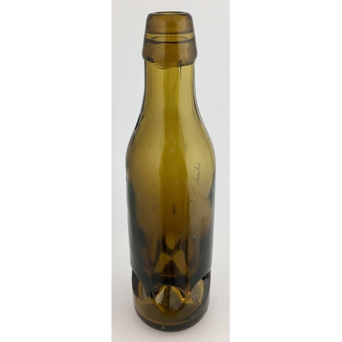 633 - WARE PREMIER PATENT BOTTLE. 9ins tall. Dark amber glass 10oz Premier Patent, 6 retaining lugs near b... 