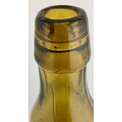 633 - WARE PREMIER PATENT BOTTLE. 9ins tall. Dark amber glass 10oz Premier Patent, 6 retaining lugs near b... 