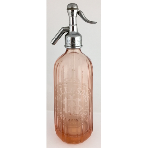 642 - BERKHAMSTED SODA SYPHON. 12ins tall to top of impressed trigger. Salmon pink coloured glass, vertica... 