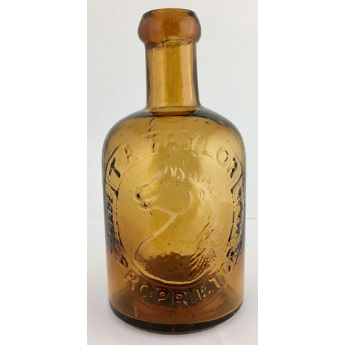 645 - T.A. TAYLOR SELTZER BOTTLE. 6ins tall. Dark amber glass, heavily embossed T.A. TAYLOR/ PROPRIETOR wi... 