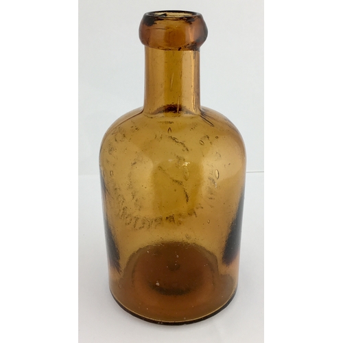 645 - T.A. TAYLOR SELTZER BOTTLE. 6ins tall. Dark amber glass, heavily embossed T.A. TAYLOR/ PROPRIETOR wi... 