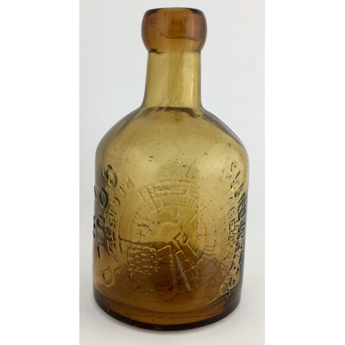 646 - ISLE OF WIGHT SELTZER BOTTLE. 6ins tall. Amber glass, embossed vertically around circular donkey in ... 